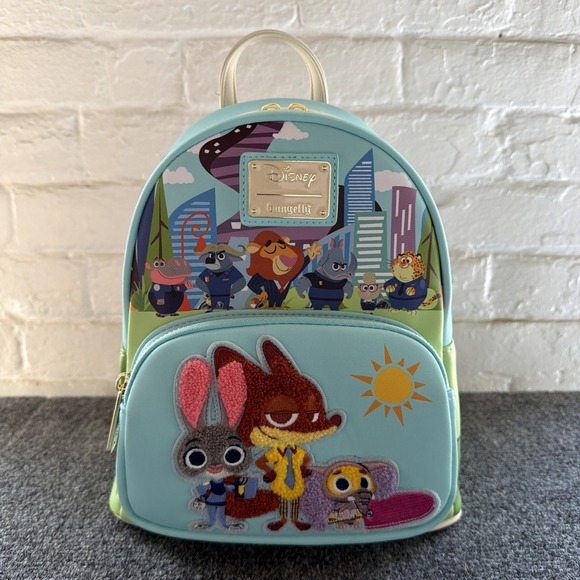 Loungefly Handbags - Loungefly Disney Zootopia Mini Backpack Blue White Green Colorway